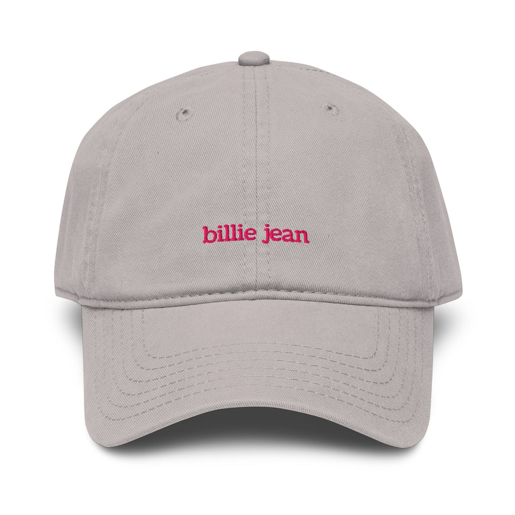 A light gray dad hat baseball cap with 'billie jean' embroidered in pink lowercase letters on the front, shown against a plain white background.