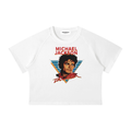 A white raglan crop top t-shirt featuring a graphic print of Michael Jackson with the text 'MICHAEL JACKSON' in red above a stylized portrait.