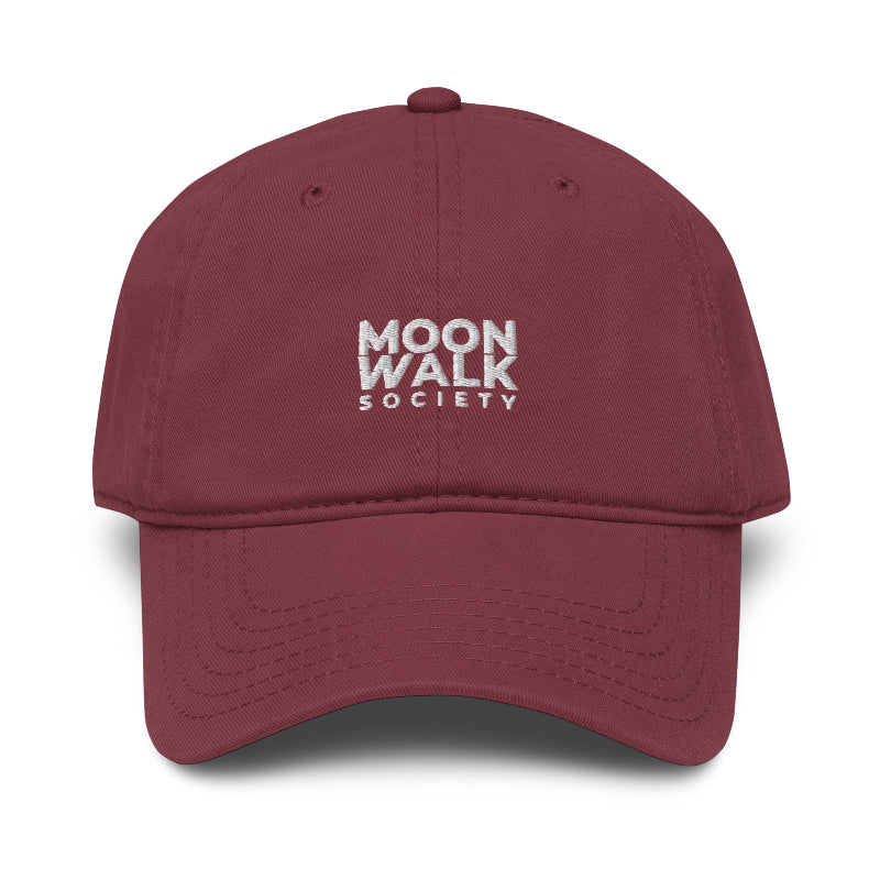 Maroon cap with 'BELIEVE WOMEN' text on a white background