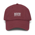 Maroon cap with 'BELIEVE WOMEN' text on a white background