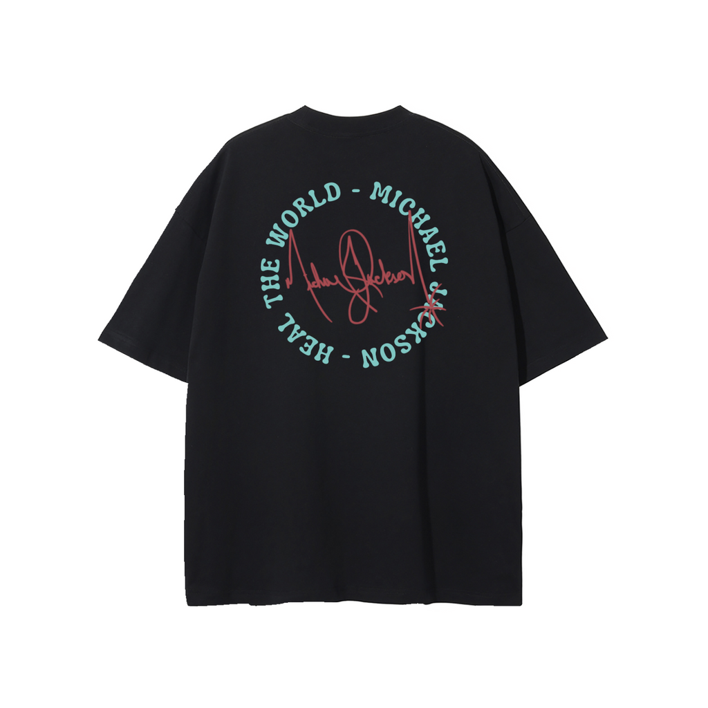 A black short-sleeve T-shirt shown from the back, featuring a circular graphic print with the words 'THE WORLD - MICHAEL J - HEAL' in mint green and a red script signature in the center.